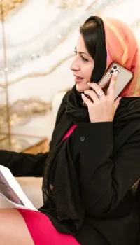 asian woman calling her immigration lawyers at legal pathway solicitors in london.